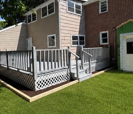 After: Back deck and railings: worn stain to a fresh gray finish